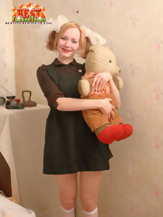 Innocent teen posing with teddy-bear